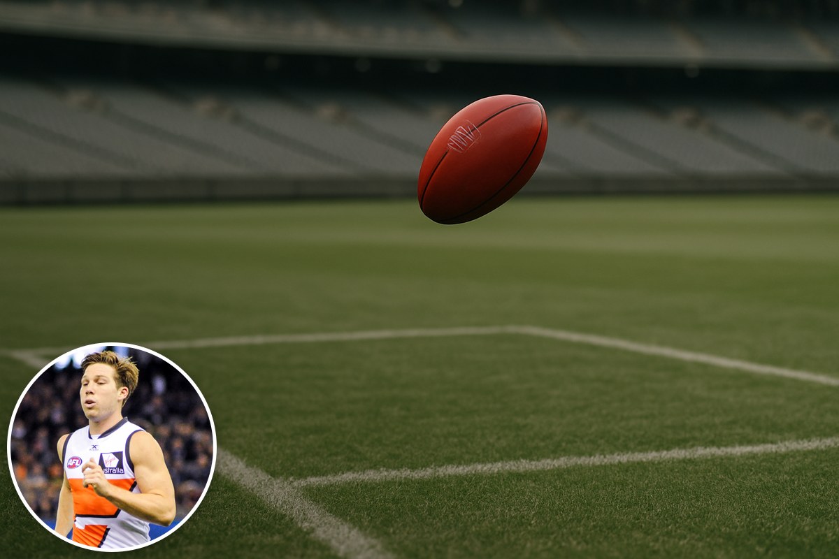 A red football mid-air over an empty stadium, with a photo of Toby Greene inset.